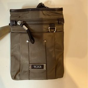 Tumi crossbody bag with adjustable strap. Like new.